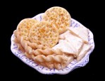 Buttered bread, crumpets and cheese straws